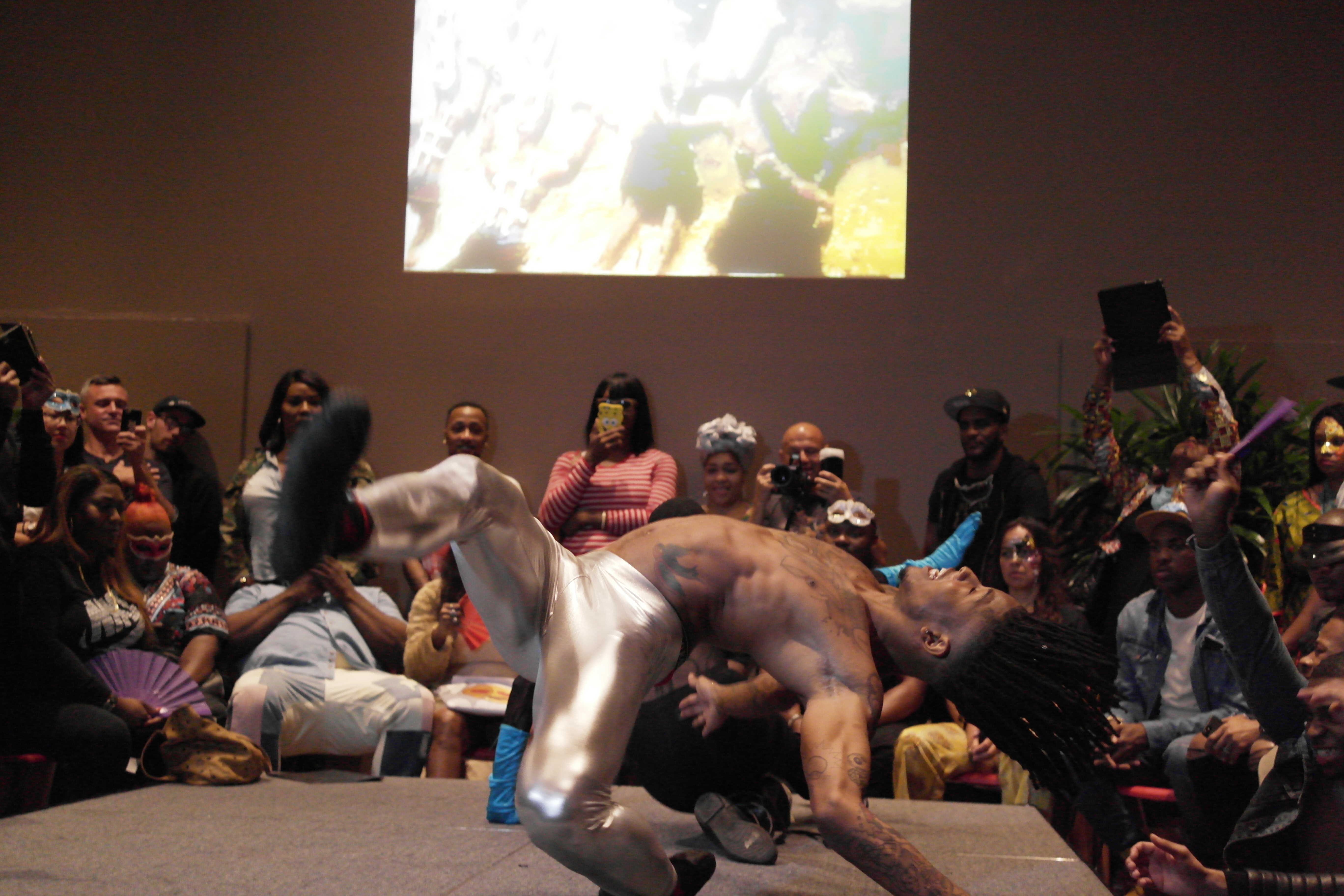 A performer voguing during a masquerade ball at the National Museum of African Art.