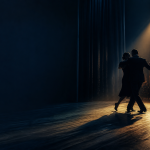 Portrait-free editorial image of an anonymous tango couple moving from a Buenos Aires dance floor into a theater spotlight